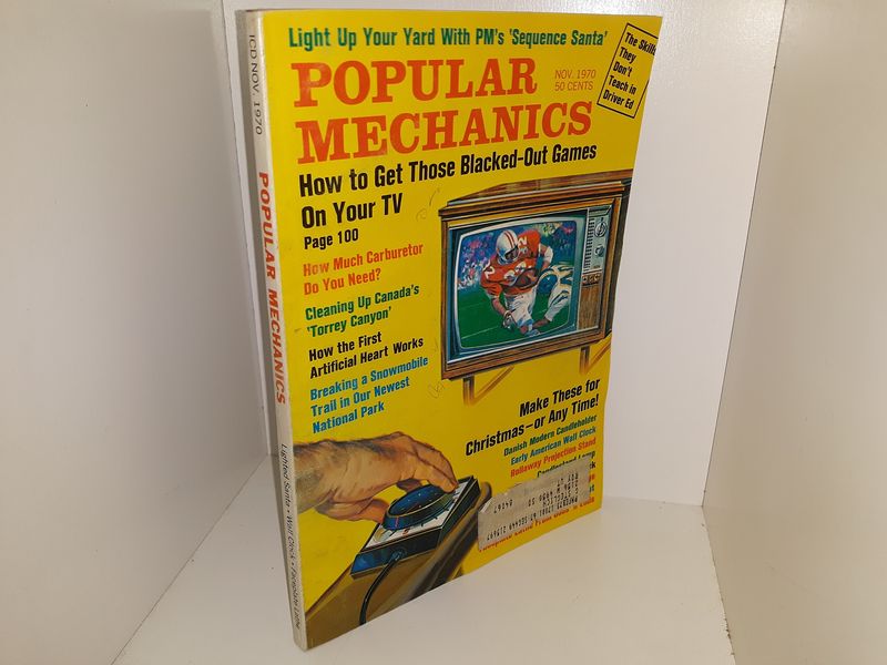 Stack of Yellowed Popular Mechanics Magazines