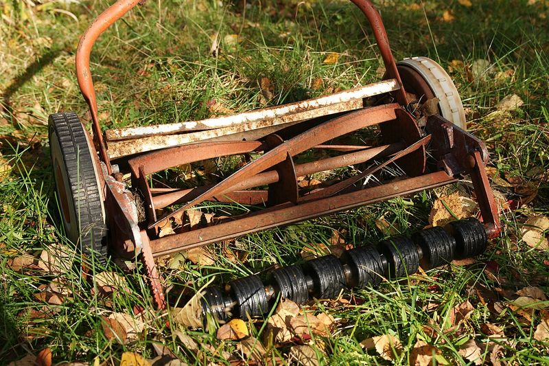 Manual Lawn Mower with a Rusted Blade