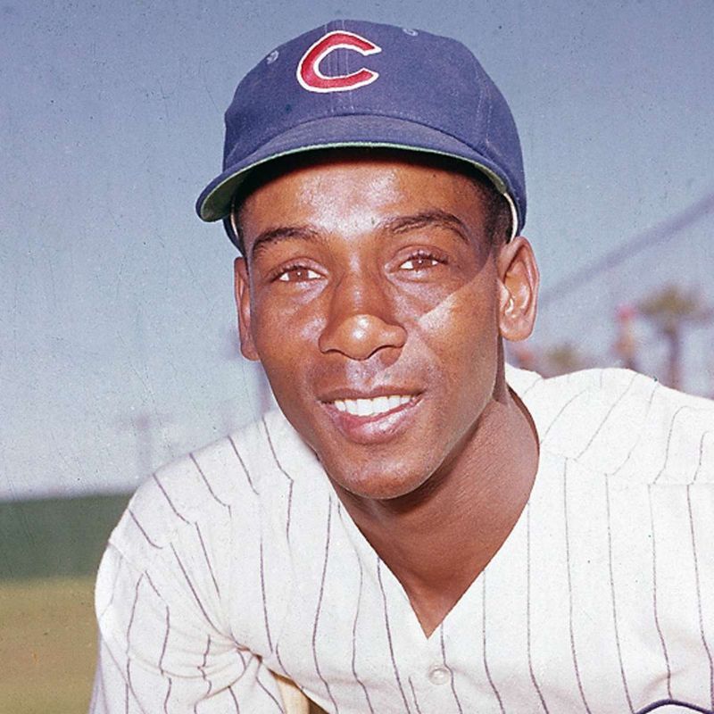 Ernie Banks Beaming in the Dugout – 1950s