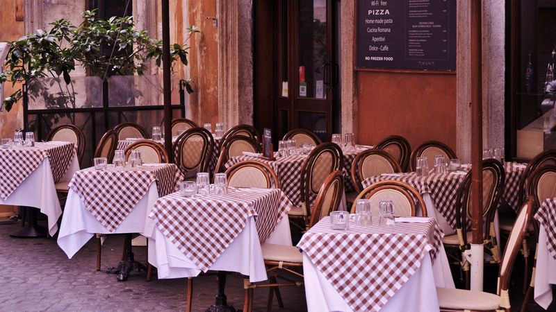 The Family Pizza Place With Checkered Tablecloths