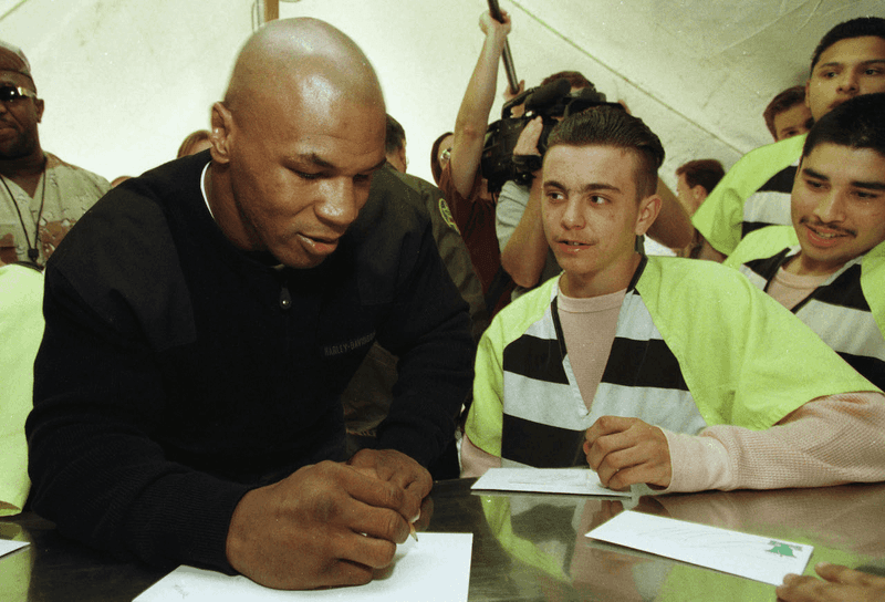 Mike Tyson signs autographs at the Maricopa County