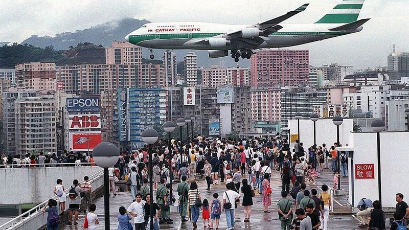 A Cathay Pacific flight comes into land in Hong Kong's Kai Tak Airport, June 27 1998